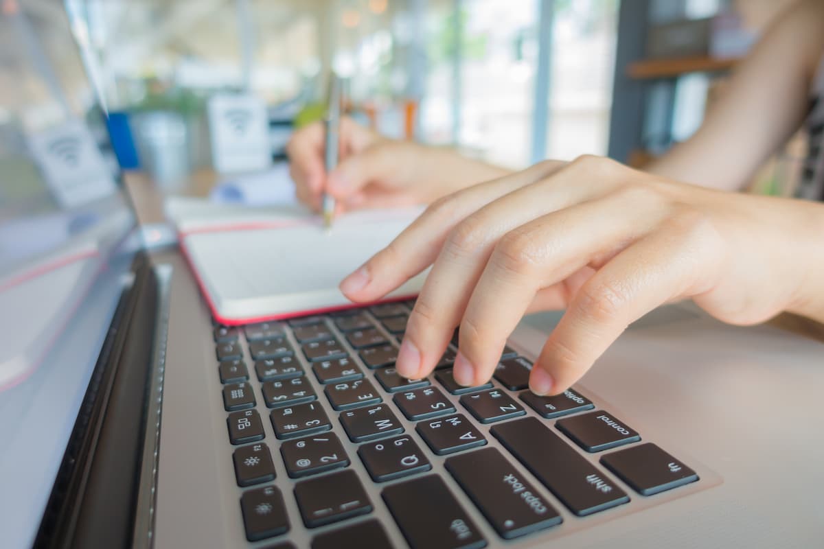 closeup business woman hand typing laptop keyboard